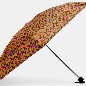 NWT Authentic Coach UV protection mini umbrella in signature disco star print.